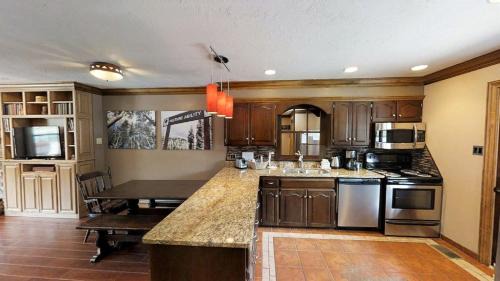 Red River Casa | Claim Jumper Townhouse 02 - On the River - Across from the Fishing Ponds - WiFi - Cable - Near Ski Area - Wood Burning Fireplace