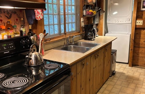 Camden Cabina | Classic lakefront family camp in Camden; large porch, dock & boats