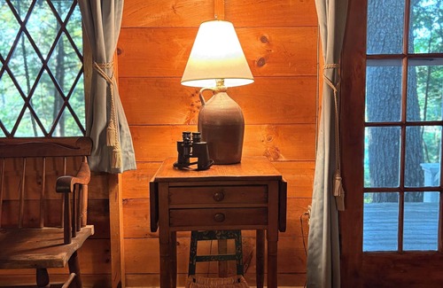 Camden Cabina | Classic lakefront family camp in Camden; large porch, dock & boats