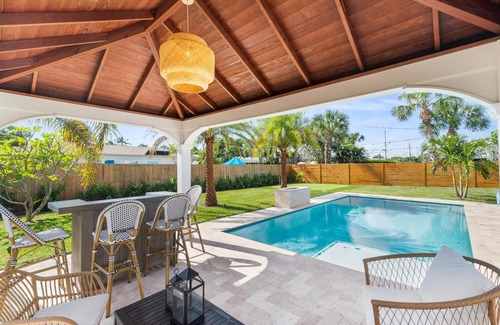 Hunt Club Casa | Clean Florida Coastal Design home with Heated Pool, Fireplace and Putt Putt