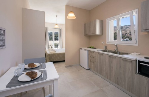 Kassiopi Apartamento | Close to the beach, spacious one-bedroom apartment with sea views.