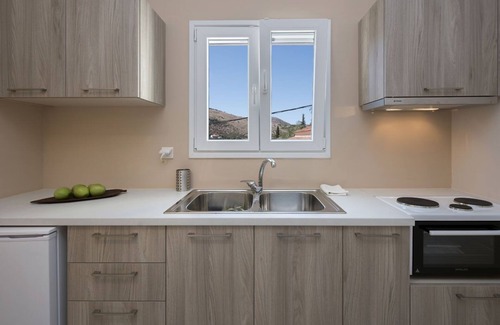 Kassiopi Apartamento | Close to the beach, spacious one-bedroom apartment with sea views.