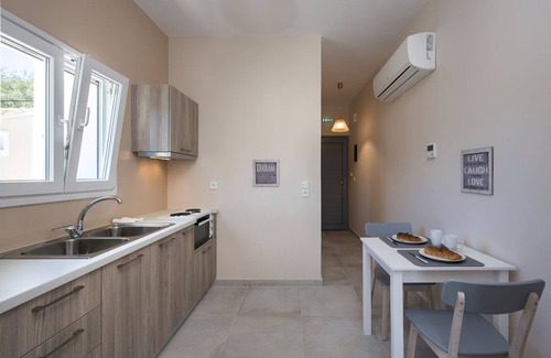 Kassiopi Apartamento | Close to the beach, spacious one-bedroom apartment with sea views.