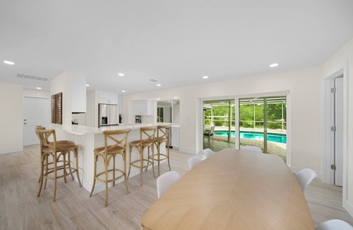 Shell Harbor Casa | Coastal Charm: Stunning Ground Level Pool Home on Canal with EastEnd Location