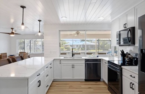 Shell Harbor Casa | Coastal Cottage on Canal, East End with Pool