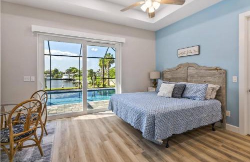 Palm Harbor Casa | Coastal Paradise Waterfront Pool Home