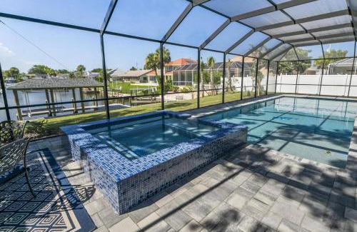 Palm Harbor Casa | Coastal Paradise Waterfront Pool Home