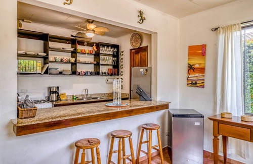 Barrio Ricos y Famosos Casa | Colorful, dog-friendly home with private pool, W/D, & lush setting