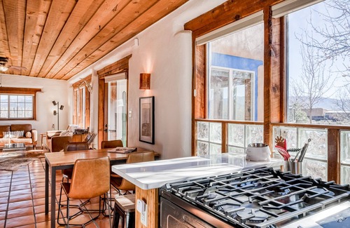 Taos Casa | Colorful dog-friendly home with sweeping views, a private hot tub, & large yard