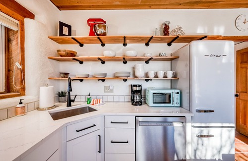 Taos Casa | Colorful dog-friendly home with sweeping views, a private hot tub, & large yard