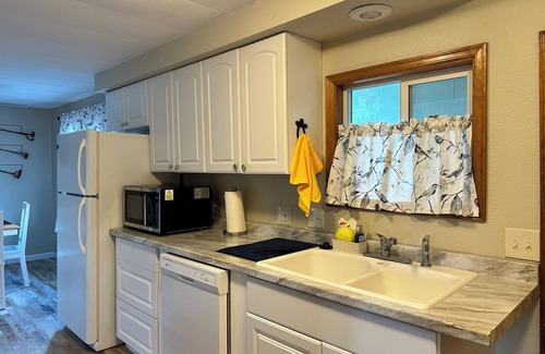 Wilbur Casa | Come for the Sun, Stay for the Fun in this charming 3 Bedroom Porch Home