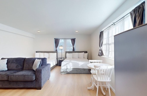 Cape May Hotel | Comfortable Coastal Retreat with Two Queen Beds & Sleeper Sofa - Suite Room