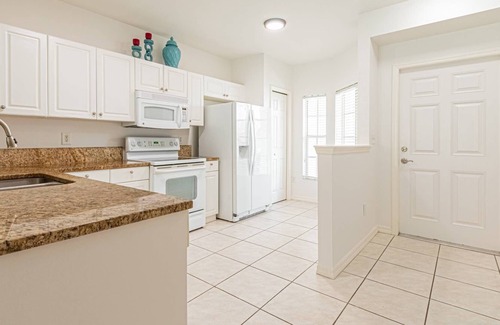 Ole Condominio | Coral Falls - 1st floor condo - private screened lanai w/views of indoor 65" TV & steps to pool/spa