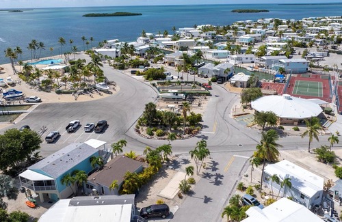 Cudjoe Key Alquiler De RV | Corner RV Lot with Lagoon Views, Palm Trees, and Steps to Pool & Amenities