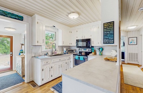 Sunset Beach Casa | Cottage on intercoastal waterway with private pool, hot tub and large dock