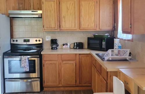 Lake Village Cabina | Cottage tucked in back of orchard with full kitchen and lake access!