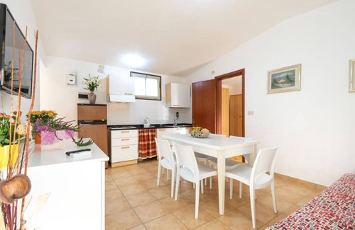 Lignano Sabbiadoro Villa | Acogedora y acogedora casa con jardín privado.