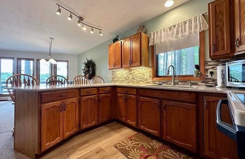 Elmira Cabaña | Cozy beachfront cottage in the woods with walkout basement and wrap-around porch