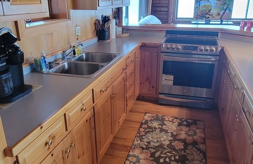 Arbor Vitae Cabina | Cozy boat house on the lake! Private dock and beautiful water views!