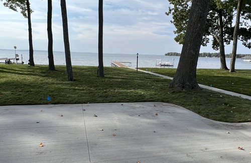 Houghton Lake Casa | Cozy Cottage, fresh laid sod, new concrete patio and sidewalk, sandy beach!