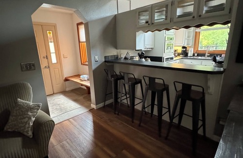 Rabbit Creek Casa | COZY HILLSIDE HOME WITH A BEAUTIFUL DECK, FIRE PIT, SAUNA & PLENTY OF PARKING