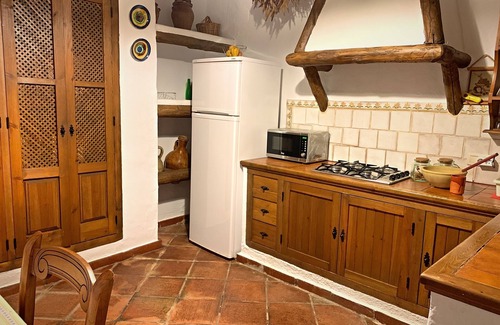 Zahara de la Sierra Cabaña | Cozy House in Zahara de la Sierra, Cádiz: Fireplace and Castle Views