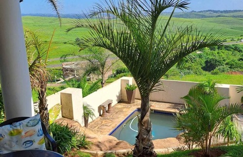 Kingsburgh Casa | Cozy one bedroom suite, with a balcony, overlooking the pool and braai area.
