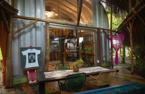 Jacó Casa | Cozy tropical / industrial quonset located in a secondary tropical forest.