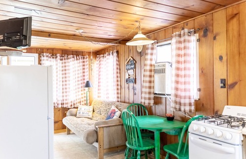 Au Sable Cabaña | Cozy cabin on Lake Huron! Firepit, grills, patio chairs and more!