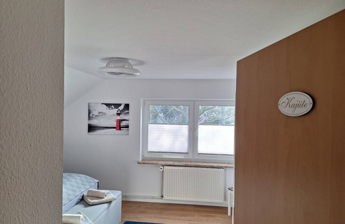 Midlum Apartamento | Cozy vacation apartment with balcony on the Wurster North Sea coast