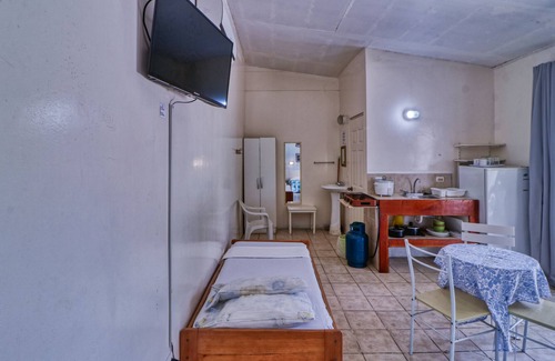 Puntarenas Apartamento | Acogedora villa frente al mar con acceso a la playa, jardines y una hermosa piscina compartida