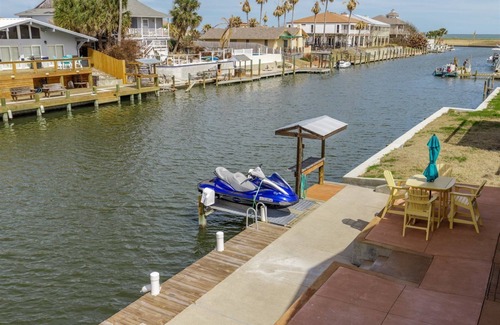 City-by-the Sea Casa | Crazy about fishing? Check out this home on deep canal near Estes Flats, Redfish Bay, and the Intracoastal Waterway!