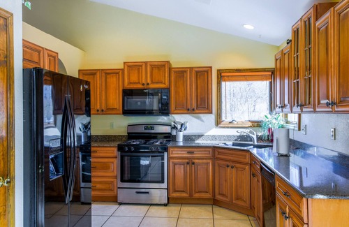 Whittier Casa | Creek-side home with private hot tub, game room, firepit, deck & mountain view