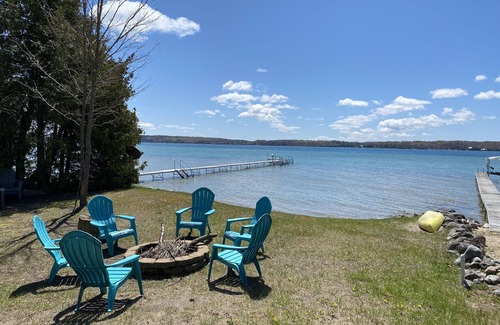 Lake Township Casa | Crystal Lake Waterfront Cottage with Private Dock, Yard, & Hot Tub