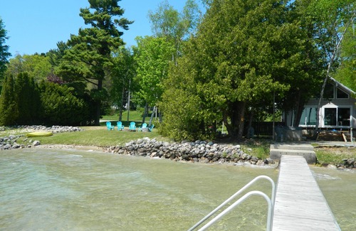 Lake Township Casa | Crystal Lake Waterfront Cottage with Private Dock, Yard, & Hot Tub