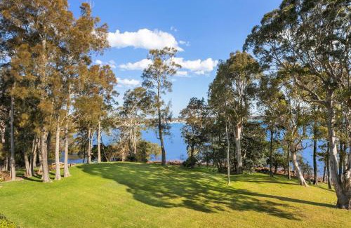 Corlette Casa | Danalene, 44a Danalene Pde - stunning waterfront property with Air Con, WI-FI, Double Lock Up Garage & Boat Parking