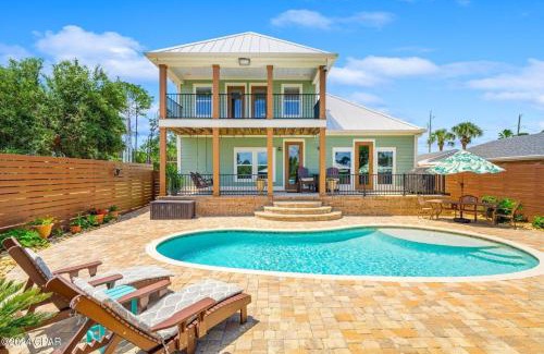 Holiday Beach Casa | Dancin on the Waves On Lagoon Boat dock, Pool, Firepit