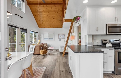 Camano Island Casa | Darling pink beach house with epic views in a cozy community.