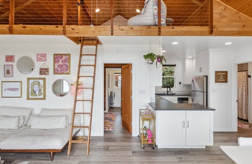 Camano Island Casa | Darling pink beach house with epic views in a cozy community.