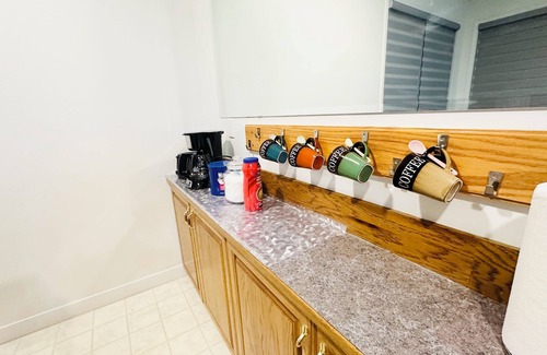 Chestermere Casa | Delightful ground level basement with AC in charming Chestermere