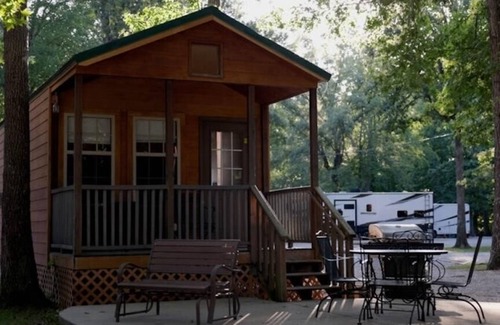 Manchester Cabina | Deluxe Cabin (w/ Bathroom) - Deluxe Cabin (w/ Bathroom) Better than a motel! Enjoy camping in comfort! Kitchen with stove top and full size fridge with dishes pots included. Full bathroom with shower. Cable TV DVD player. Gas grill on your own concre