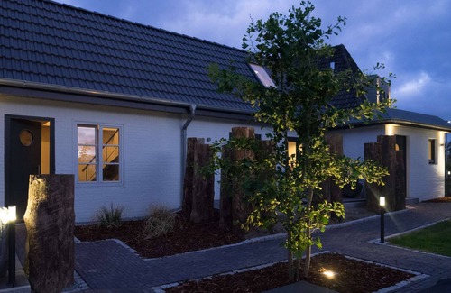 St. Peter-Ording Apartamento | Estudio de diseño en 2 niveles. Piscina, sauna, jardín, terraza.
