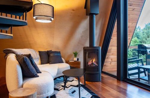Johnson Casa | Designer A-Frame Treehouse with hot tub on river