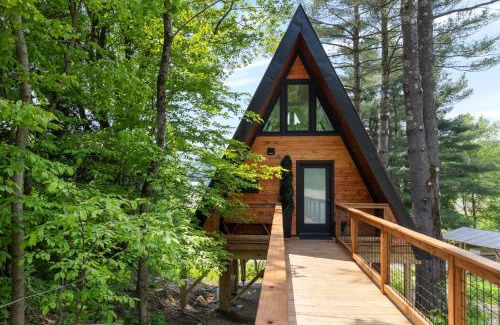 Johnson Casa | Designer A-Frame Treehouse with hot tub on river