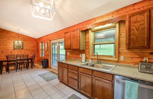 McHenry Cabina | Dog-friendly home with private pond, wraparound porch & fireplaces