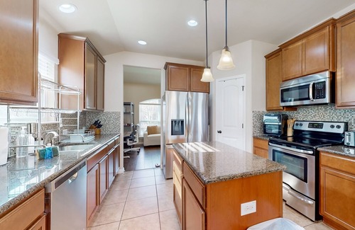 Pflugerville Casa | Dog-friendly house with patio, enclosed backyard and shared pool