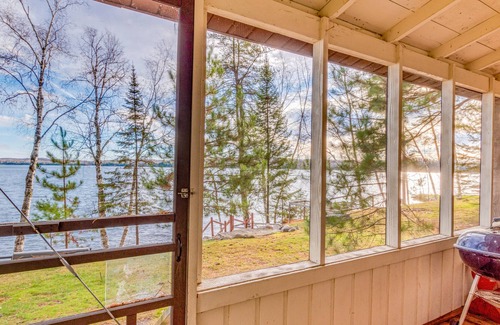 Presque Isle Cabina | Dog-friendly lakefront cabin with on-site swimming, fishing, & rec room