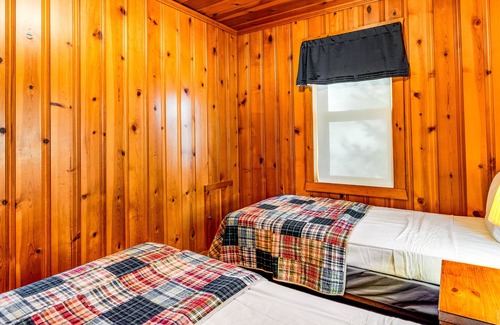 Presque Isle Cabina | Dog-friendly lakefront cabin with on-site swimming, fishing, & rec room