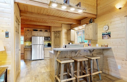 Elk City Casa | Dog-friendly riverfront home near town with deck, water views, & fireplace