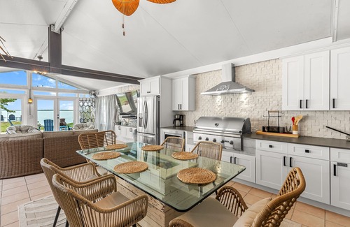Bay Point Casa | Dog-friendly waterfront home with outdoor kitchen, bar, firepit, & kayak launch